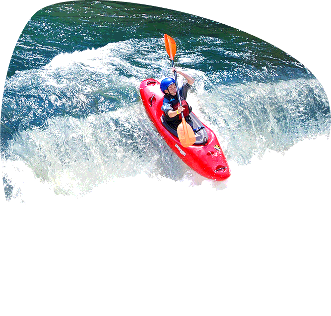 Kayaker descending a small waterfall in the Smoky Mountains. Paddler is leaning back and the front of his red kayak is extending out past the lip of the drop.